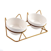 Trosetry cat bowls tilted on raised stand for comfortable meals and reduced strain.