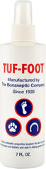 TUF-FOOT bottle 7oz demonstrates paw protection for dogs on rough surfaces.