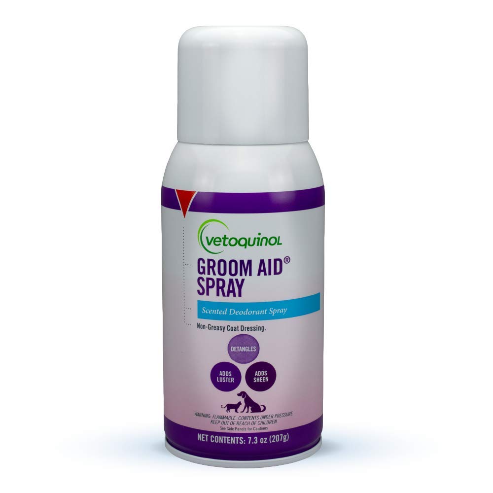Vetoquinol Groom-Aid spray bottle demonstrates detangling and deodorizing action on a pet coat.