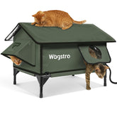 Wagstro Gable heated cat shelter outdoors in olive green; keeps feral cats warm outdoors.