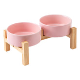 Welloyed elevated ceramic dog bowl set on bamboo stand supports comfortable eating posture