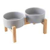 Welloyed raised ceramic dog bowls on bamboo stand for ergonomic feeding and clean floors.
