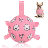 WYNTRIUM dog soccer ball with straps closeup shows grab tabs for easy play.