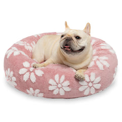Yaning donut dog bed pink with ultra-soft plush fabric for cozy naps.