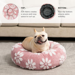 Yaning donut bed pink shows 360° calming surround for secure snuggling.