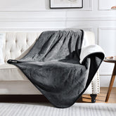Yaning waterproof blanket protects bed and couch from spills and fur.
