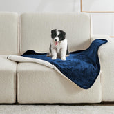 Yaning waterproof blanket on a bed protecting against spills and pet accidents