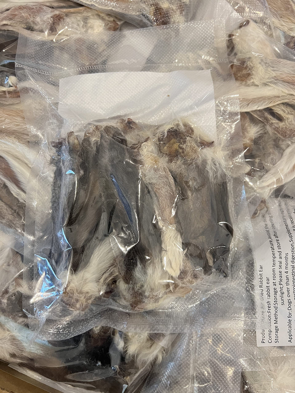 Air Dried Rabbit Ears training-treat shot for rewarding canine learning.