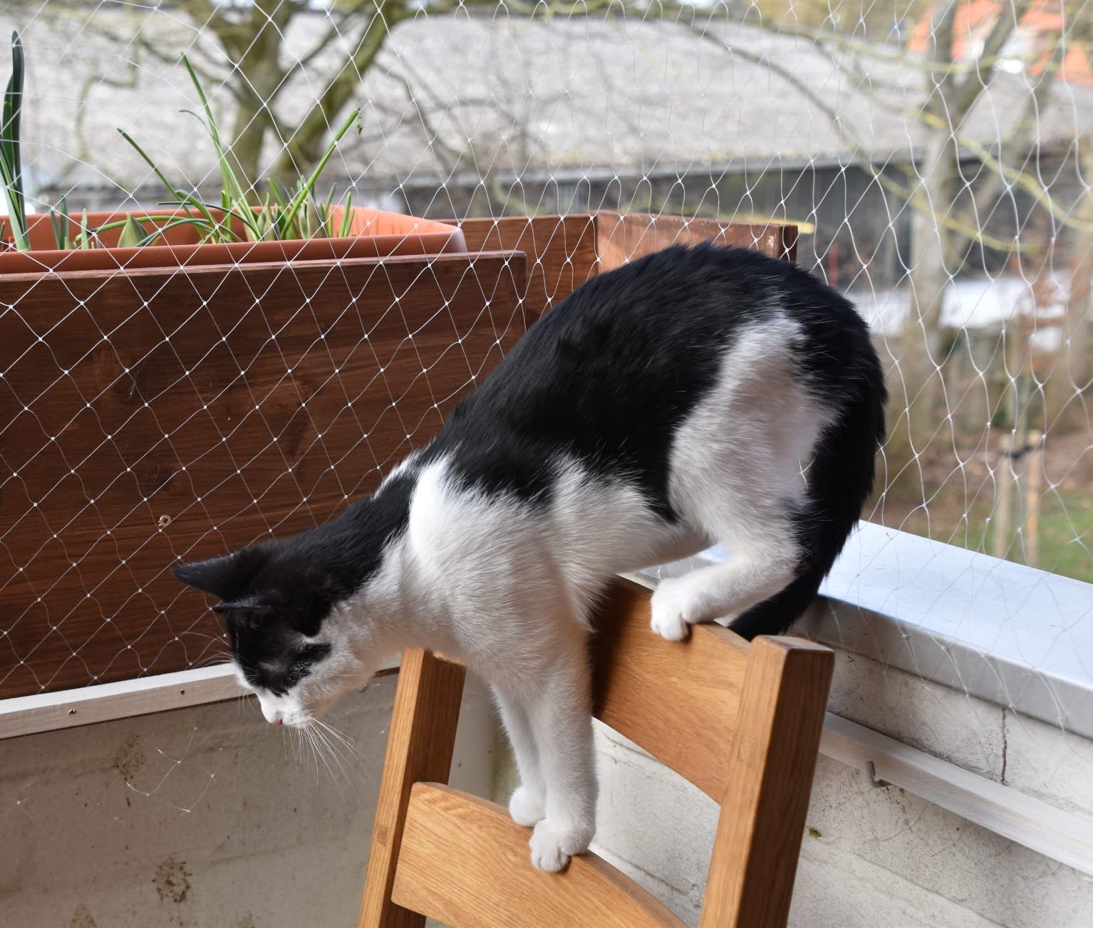 AIYGO cat balcony netting patio setup shows versatile use on terraces and gardens