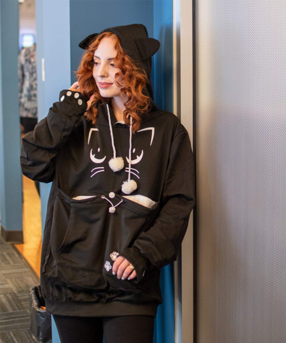 ALYC cat-print design visible on black hoodie adds playful everyday style