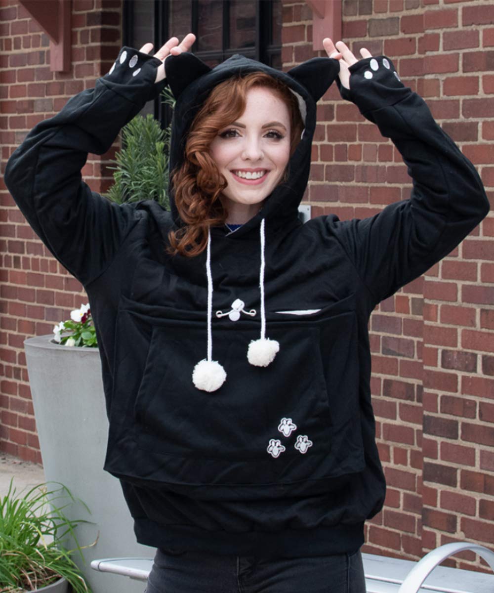 ALYC hoodie worn with pet on a walk demonstrates hands-free convenience.