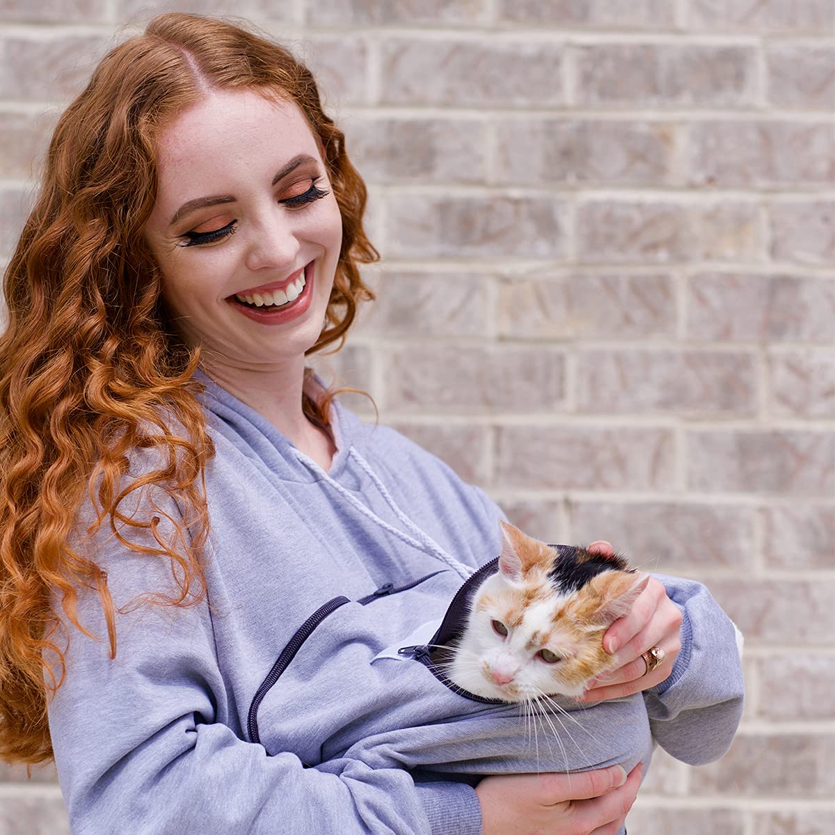 ALYC Pet Carrier Hoodie side pocket keeps hands warm while carrying your pet.