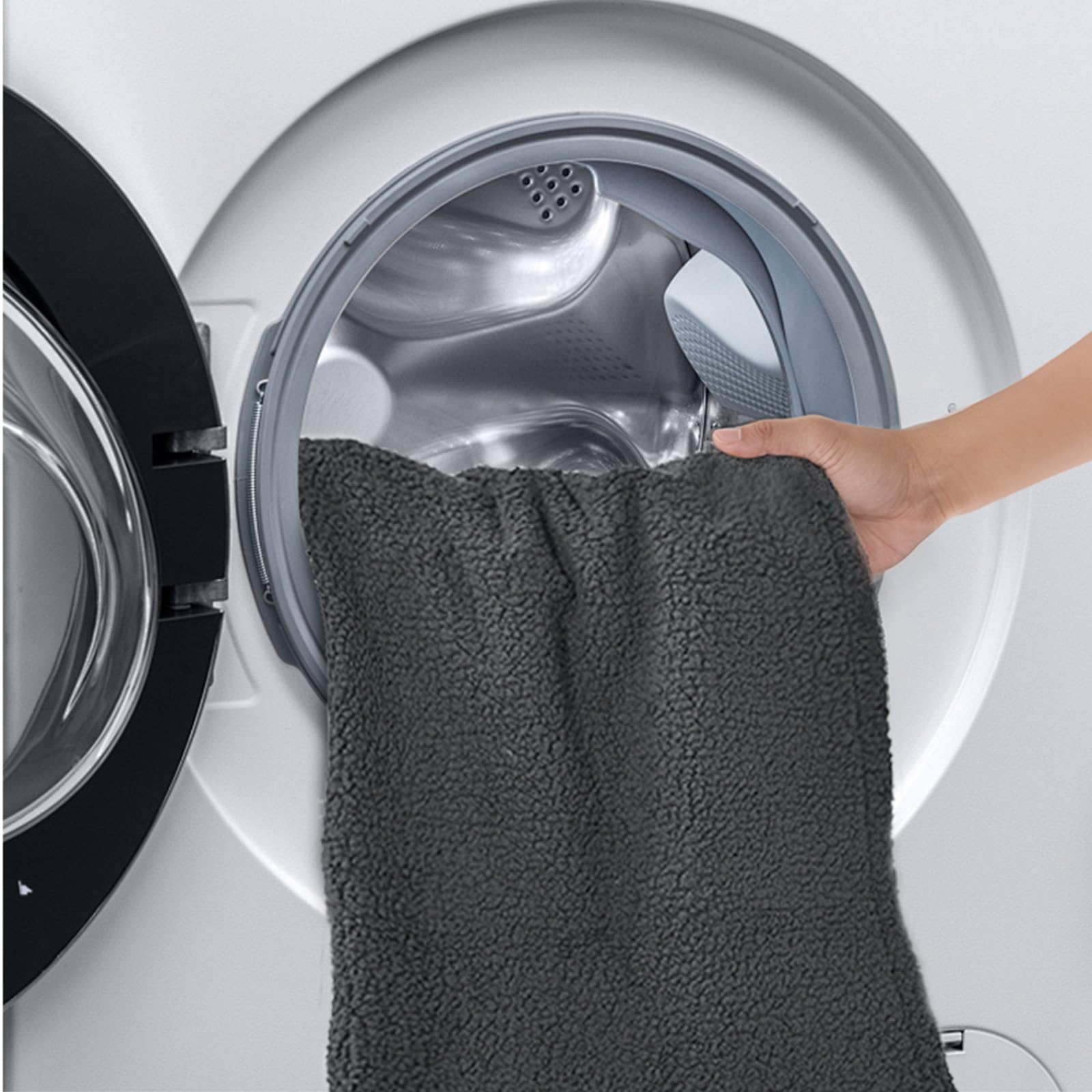 Amazon Basics pet blanket being washed to illustrate easy care