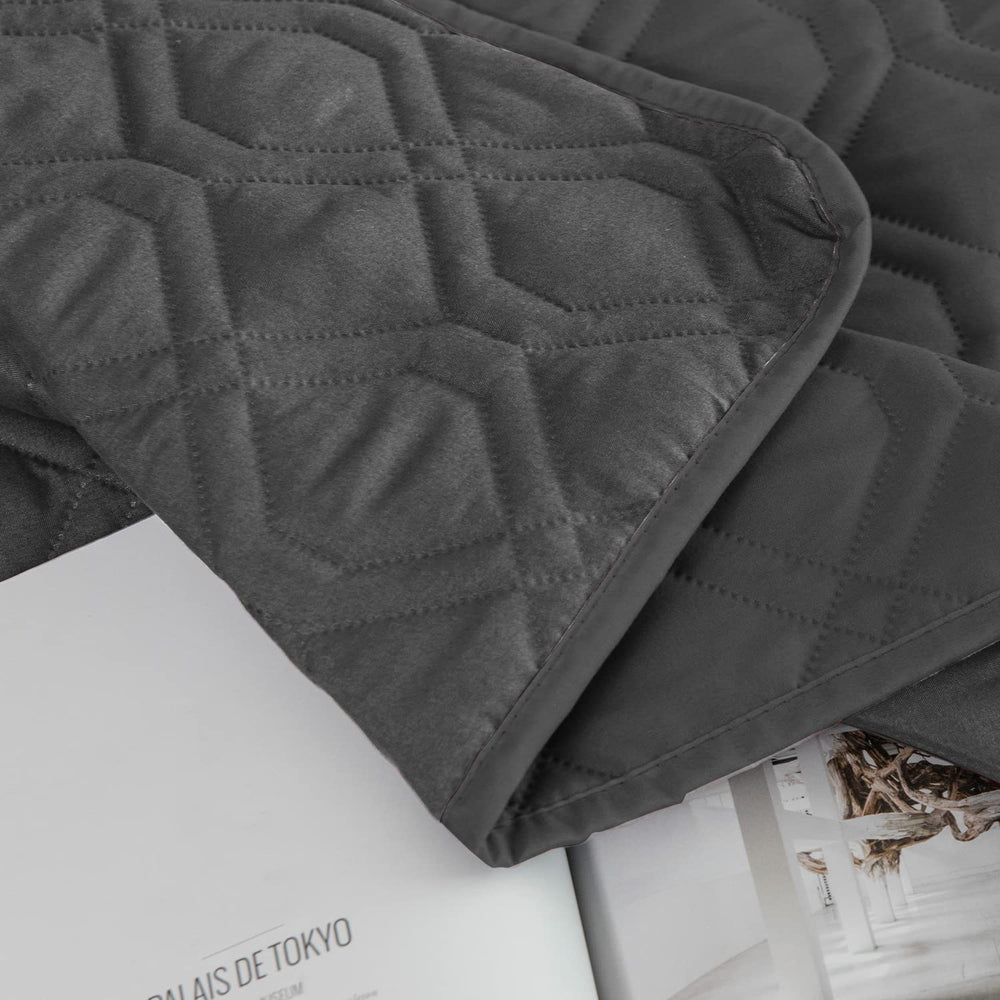 Ameritex reversible furniture cover shows two sides, matching decor while shielding upholstery.
