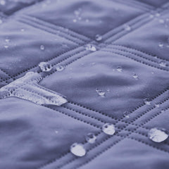 Ameritex waterproof bed cover closeup material highlights 5-layer design and odor control.