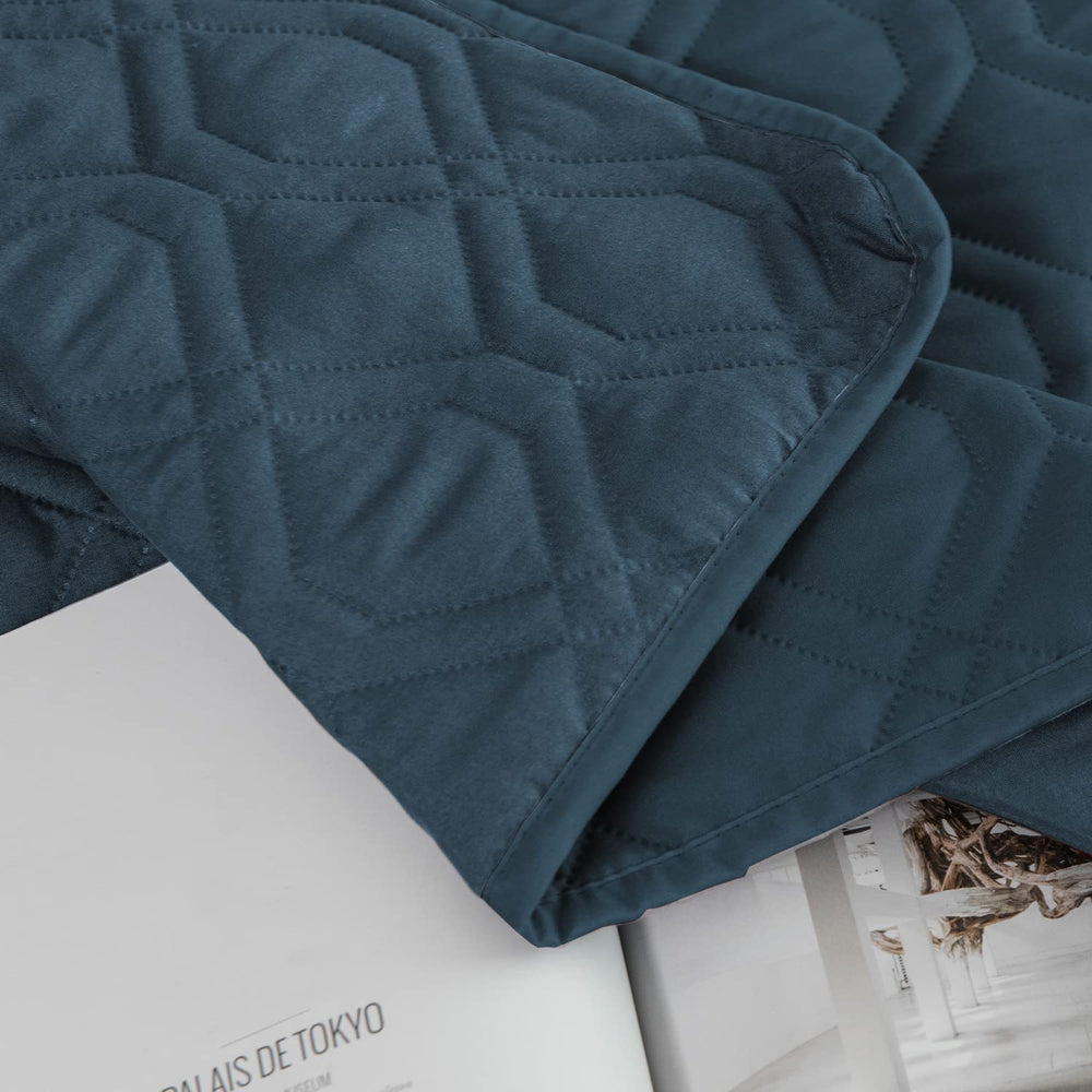 Ameritex reversible blanket displays dual-sided fabric for two looks.