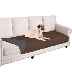 Ameritex waterproof dog bed cover on a sofa protects against spills and paws.