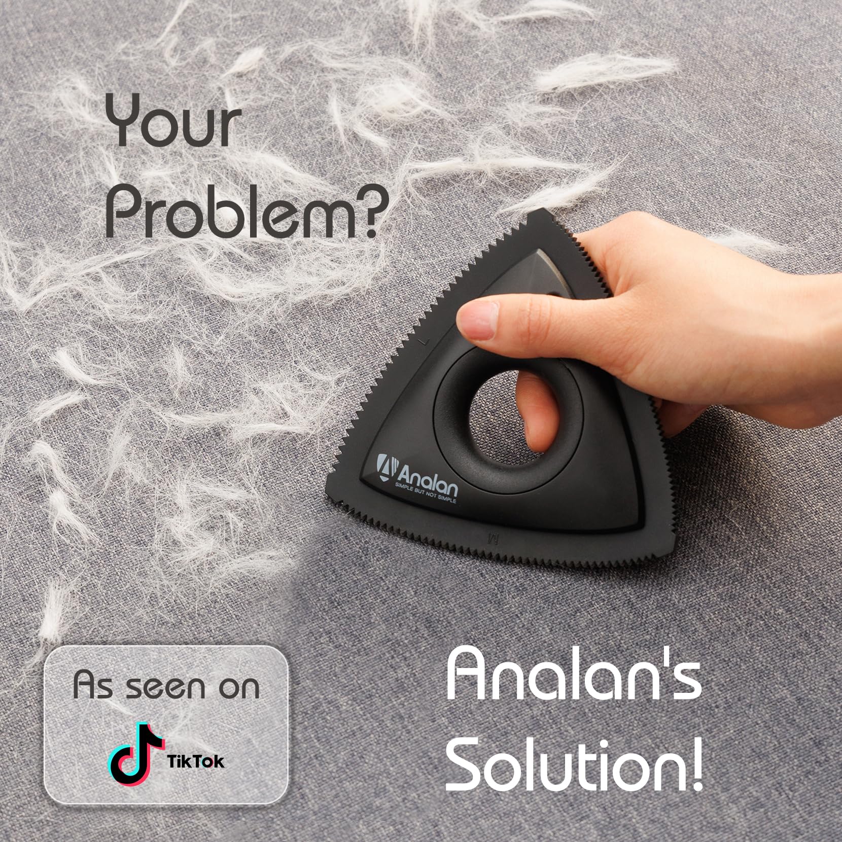 Analan triangle-design pet hair remover in action, gathering stubborn fur from upholstery with ease.