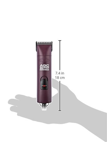 Andis burgundy clipper on workspace ready for all coats.