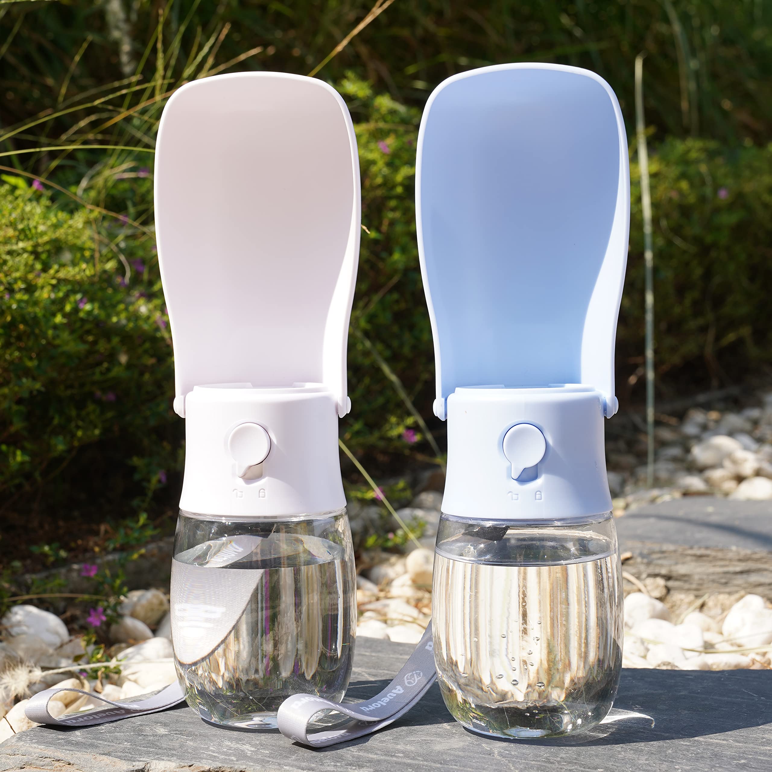AVELORA foldable dog water bottle on bag for easy carry during outdoor adventures.