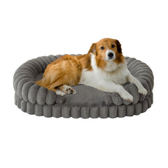 BALANCE calming dog bed 36-inch oval side view supports neck as dog curls up in comfort.