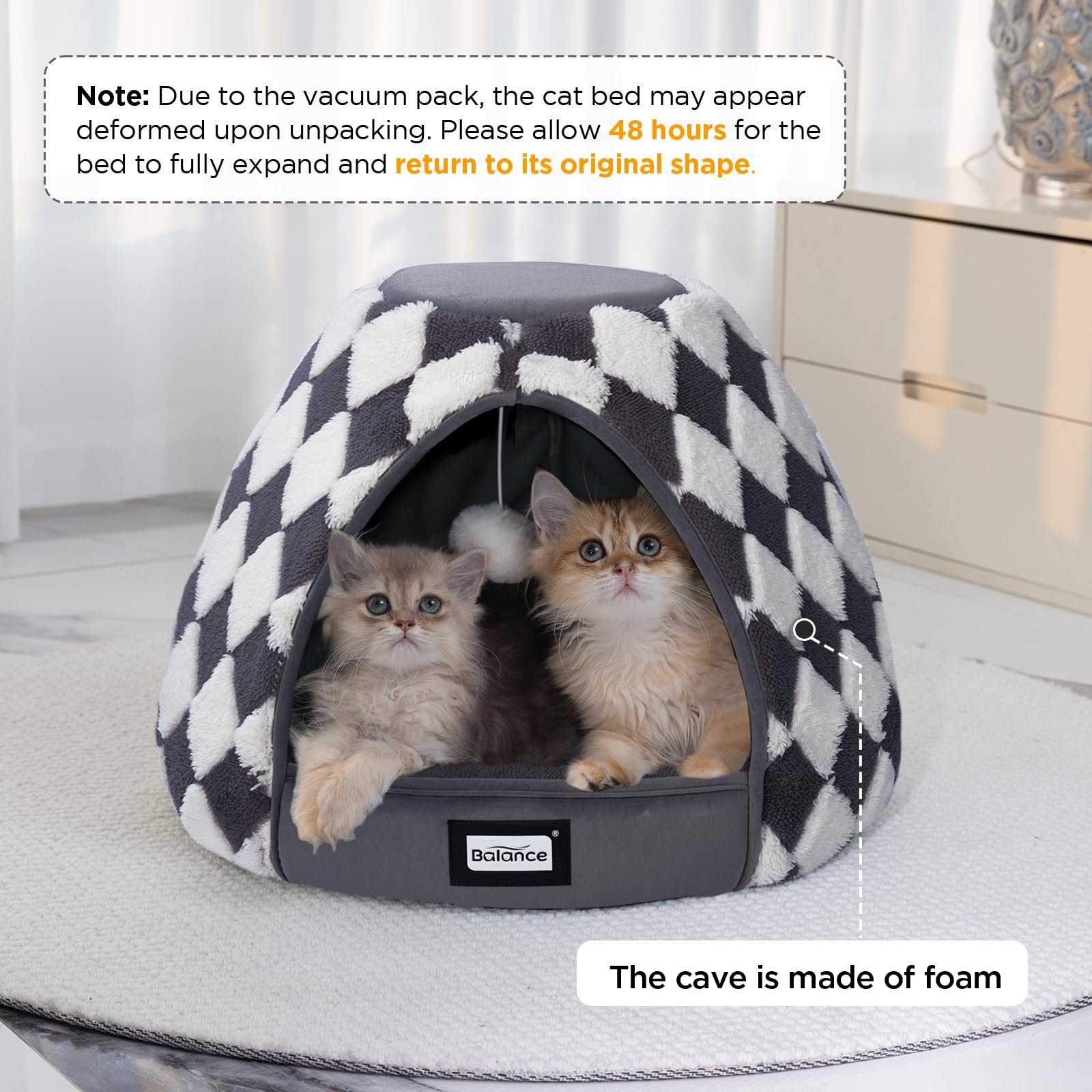 BALANCE cat bed cave entrance with hanging toy invites playful exploration and activity.