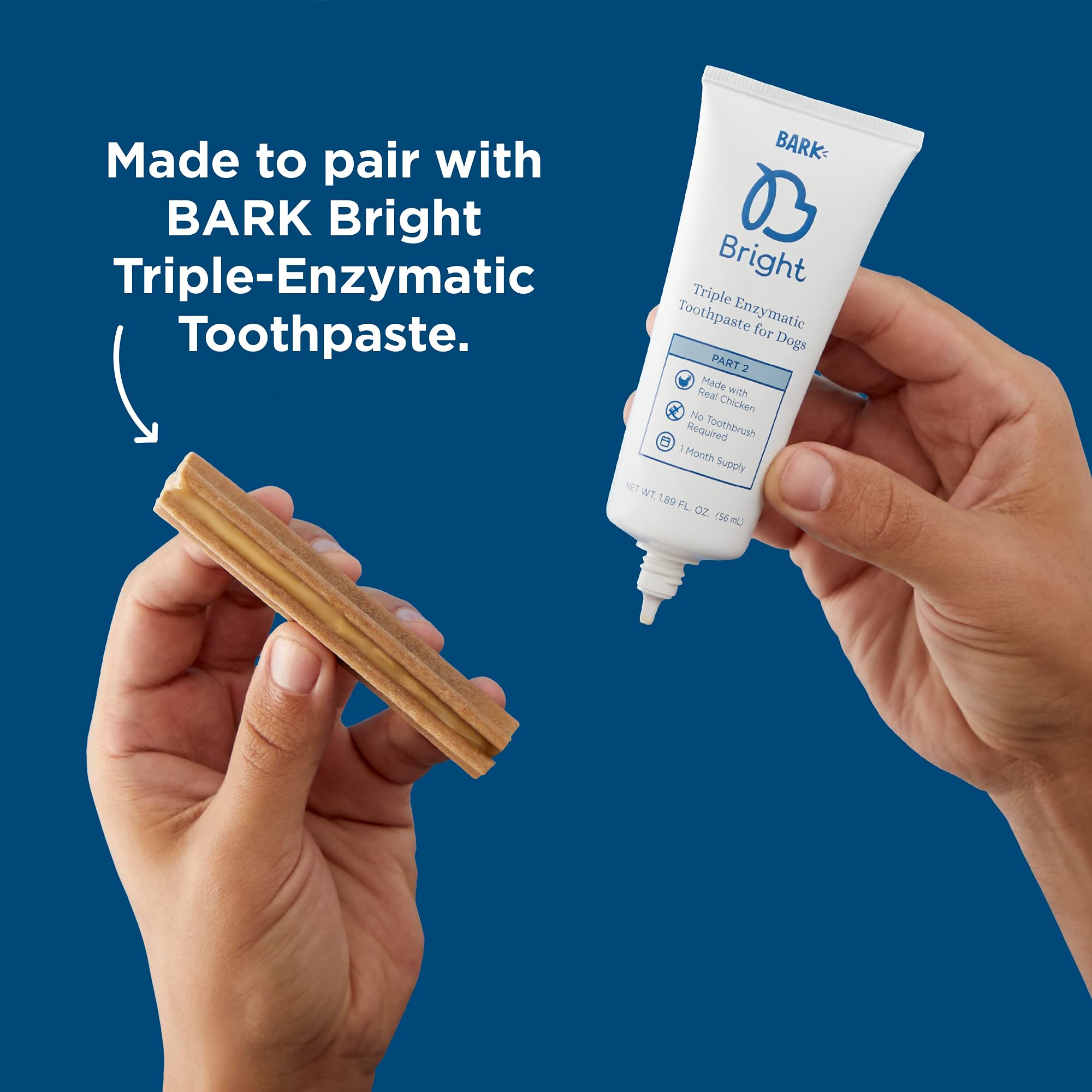 Dog enjoying a BARK Bright dental stick during play.