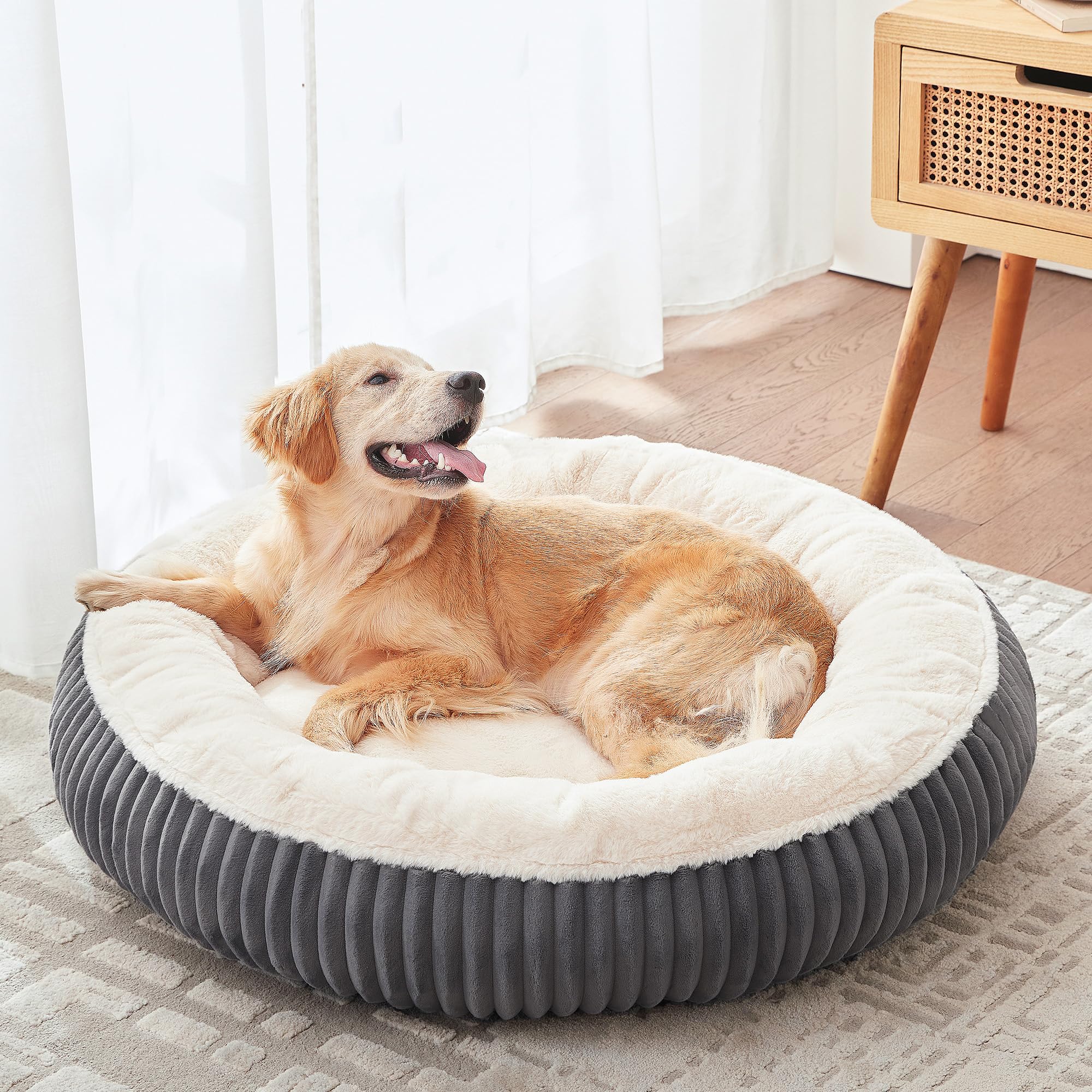 BedStill donut bed top view highlights supportive shape for larger dogs with joint relief potential.