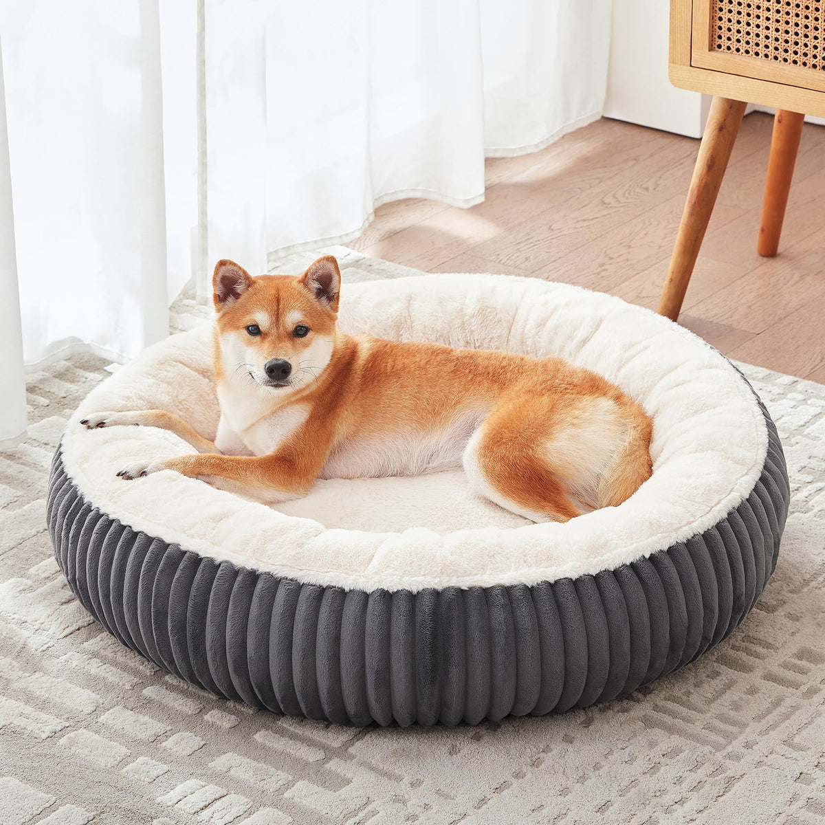 BedStill donut dog bed in dark grey with 33-inch diameter supports medium to large dogs.