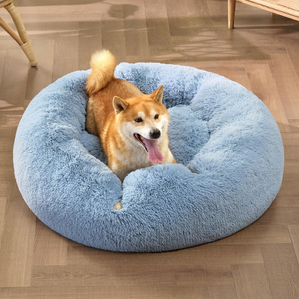 Bedsure calming dog bed light blue fabric blends with home decor for serene naps.