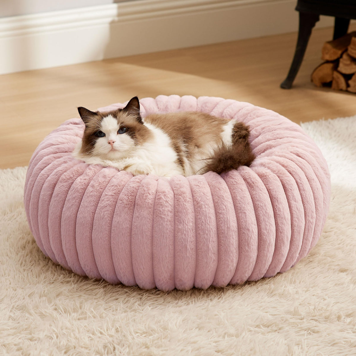 Bedsure cat bed donut-blush-pink offers a snug lounging haven for daily naps.