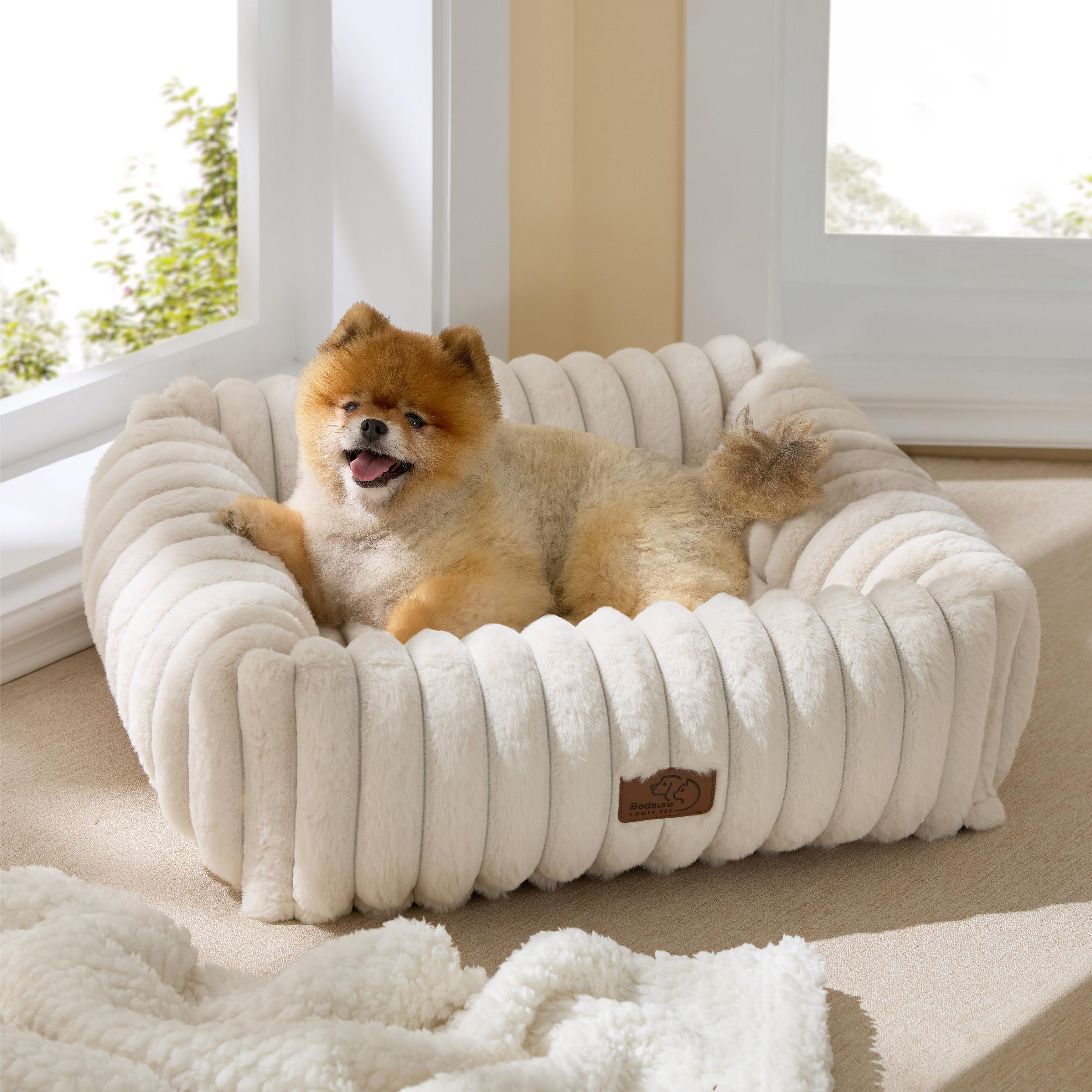 Bedsure cute dog bed cream side view shows raised edges for secure lounging.