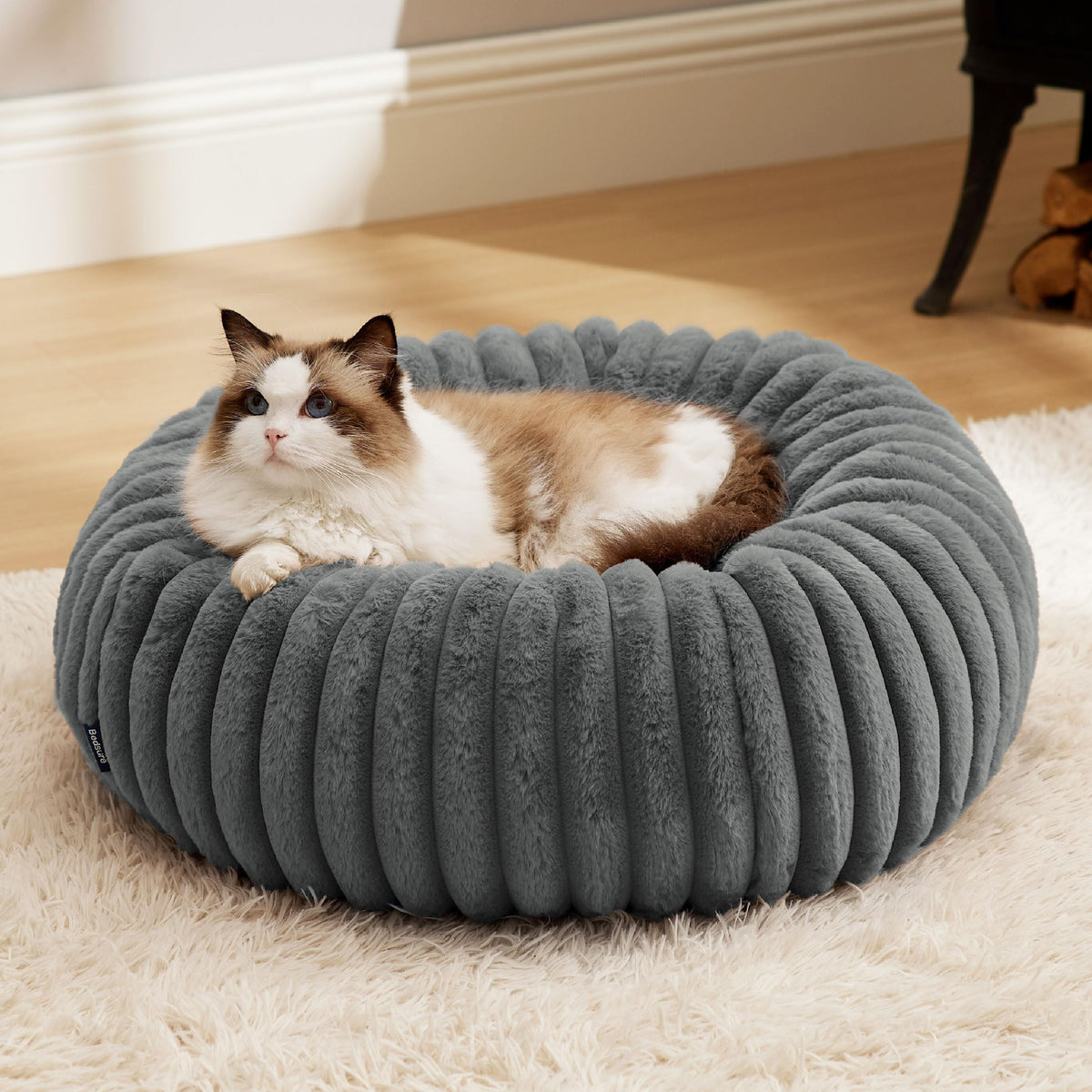 Bedsure donut bed warm grey side view shows cozy lounge for indoor pets daily relaxation