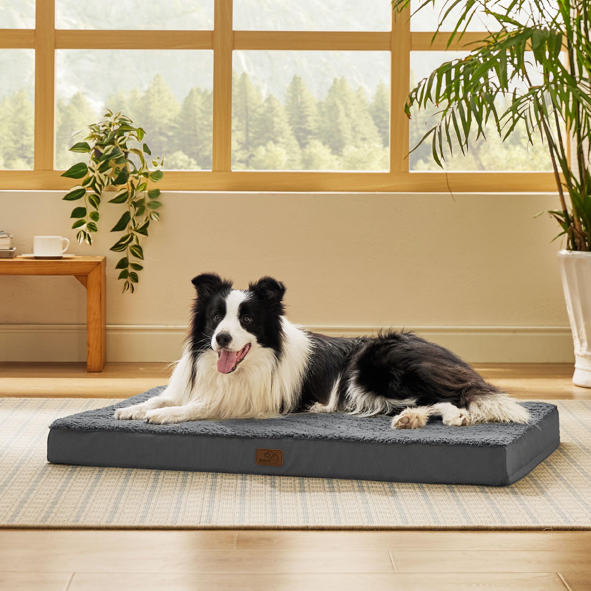 Bedsure large dog bed with egg crate foam provides joint-friendly support for naps.