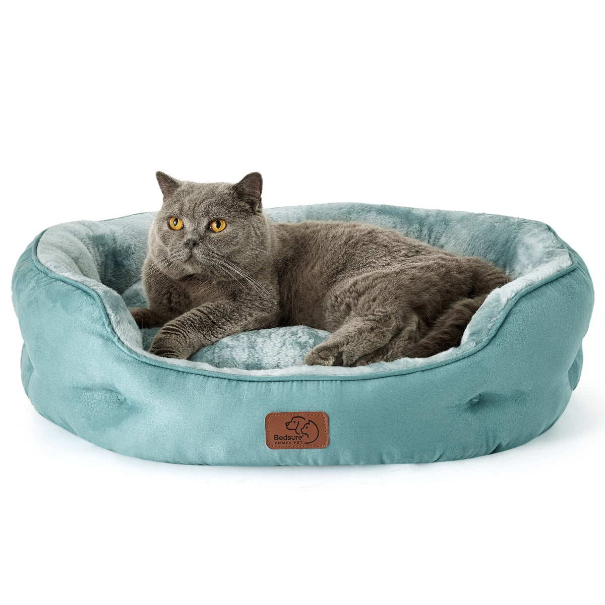 Bedsure round dog bed on floor ideal for small dogs to snuggle comfortably.