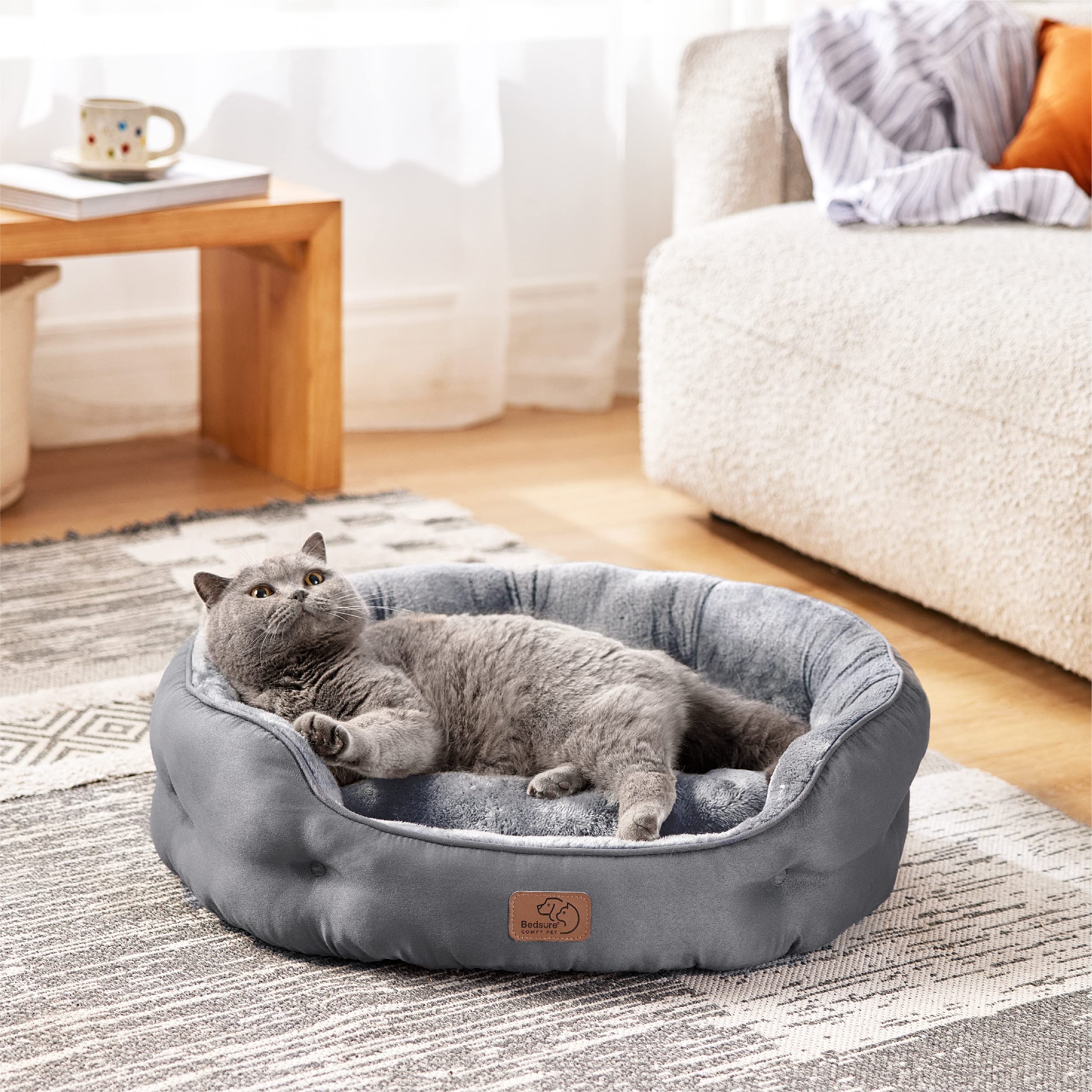 Bedsure round cat bed bolstered for secure indoor snuggling.