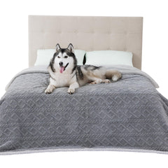 Bedsure waterproof dog blanket on bed shows spill-proof protection and cozy comfort.