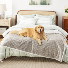 Bedsure waterproof dog blanket on bed protects linens from spills and accidents.