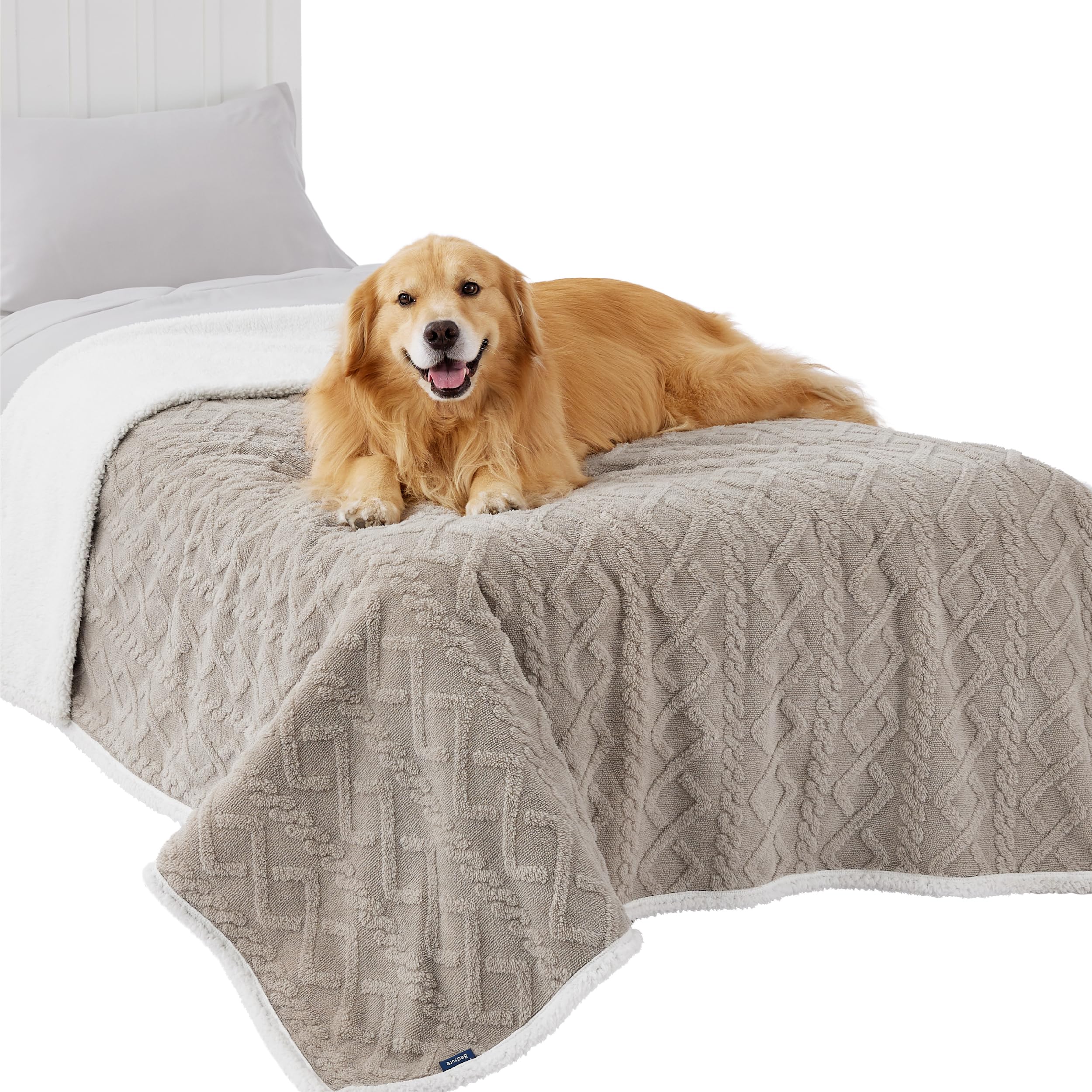 Bedsure waterproof dog blanket large-dogs-pale-oak on bed provides warm protective coverage.