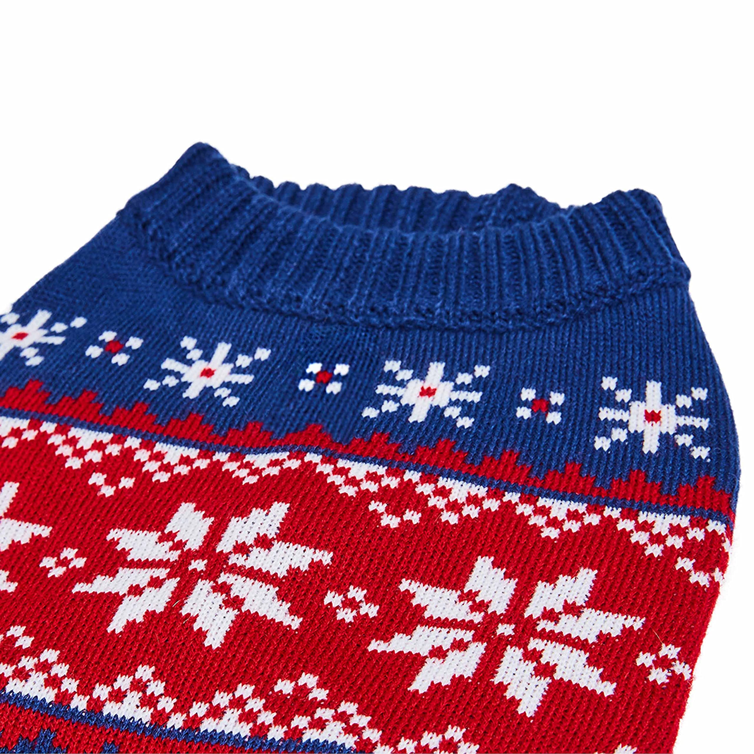 Blueberry Pet navy snowflake sweater on dog during walk