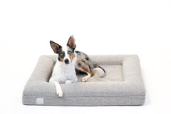 Bluewater Dog luxury boucle bed front view with neck-supporting bolster.