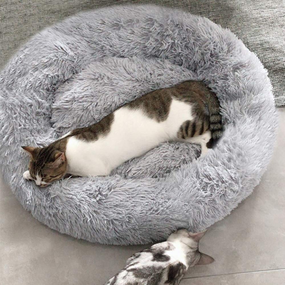 BODISEINT faux fur donut bed inner view with cushioned surface for snuggling.