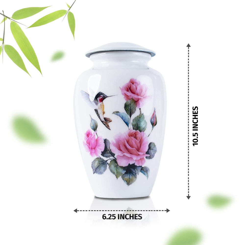 Bold & Divine hummingbird urn on a display shelf offers serene memorial focal point.