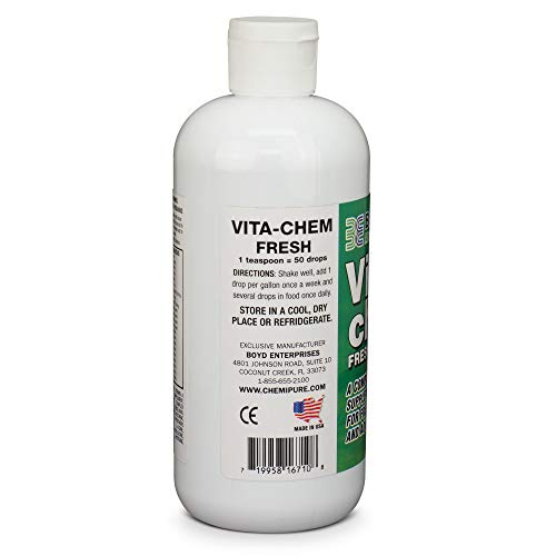 Vitachem drops dispense into a tank, supporting color and growth in community freshwater fish