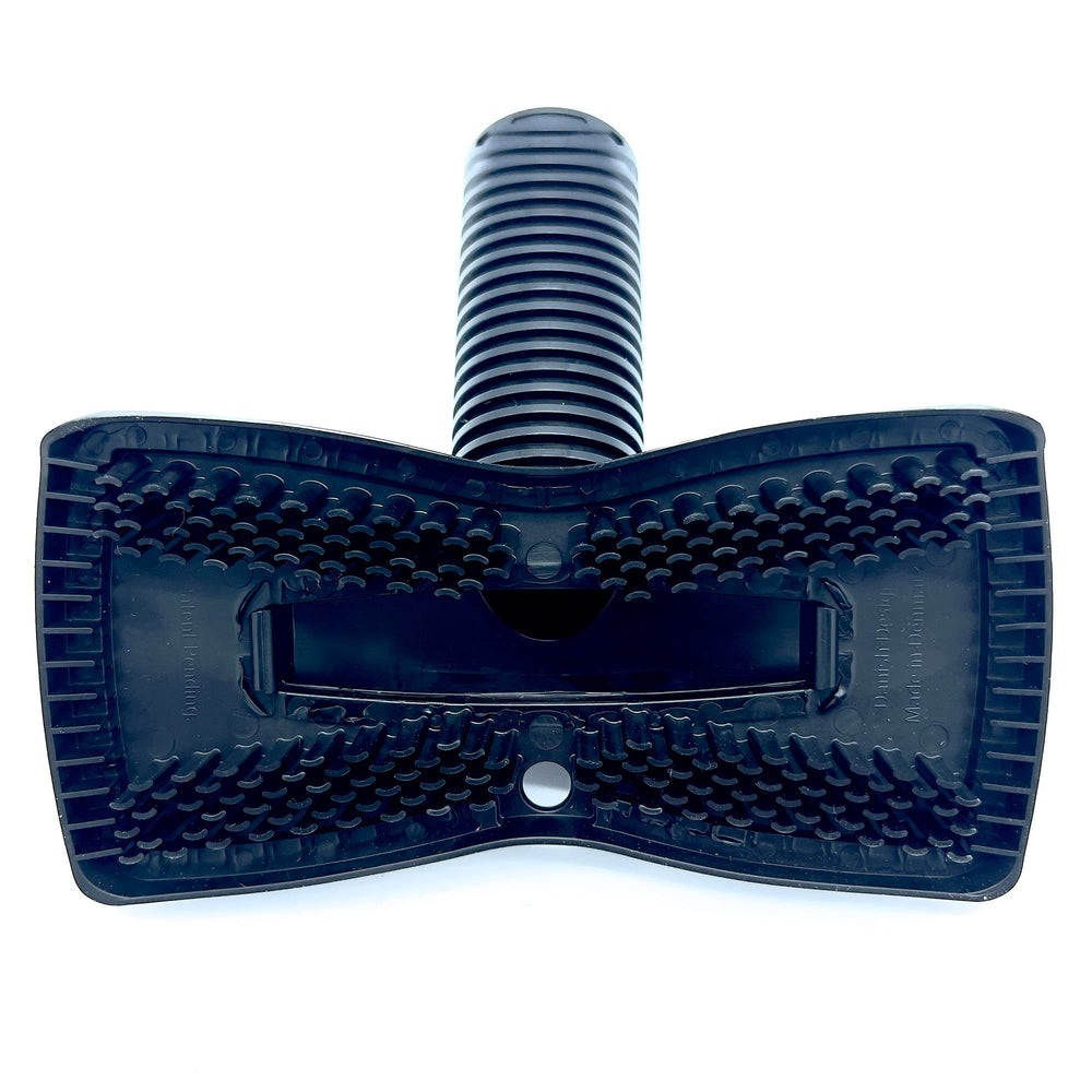 Buff Brite Fur-EEL hammerhead on a wide surface, pulling lint with silicone teeth.