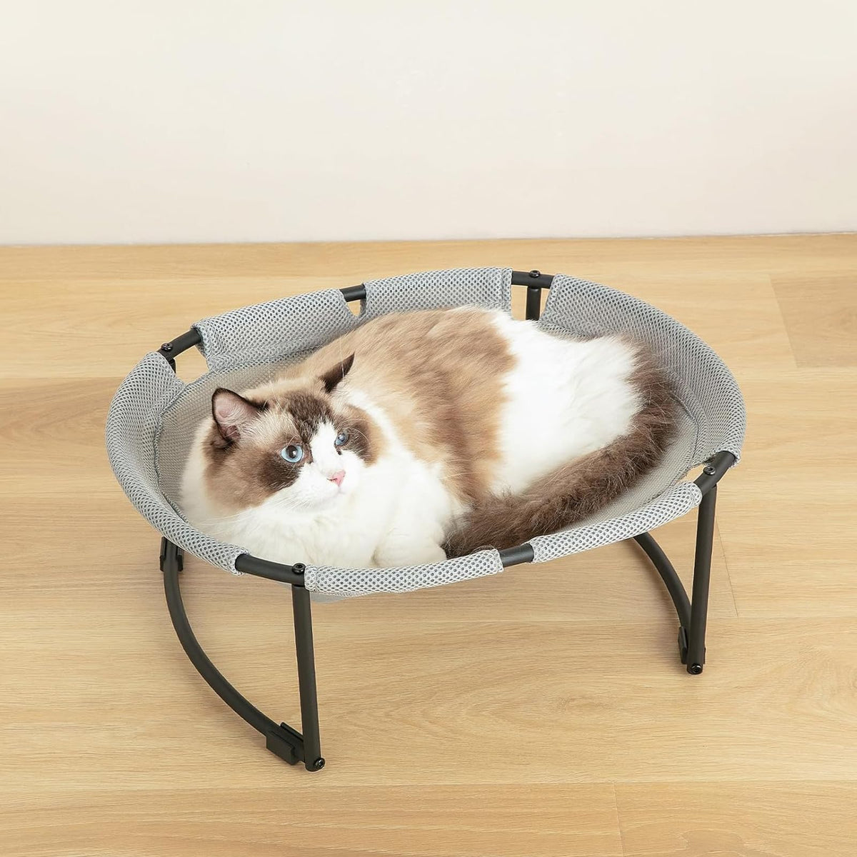 CatAve Cat Bed Hammock with oval sunken design promotes secure lounging indoors.