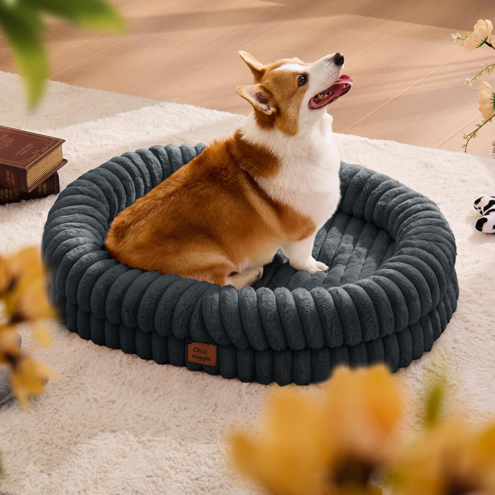 ChiXnuggle large dog bed with plush faux-fur texture for cozy naps and calming comfort.