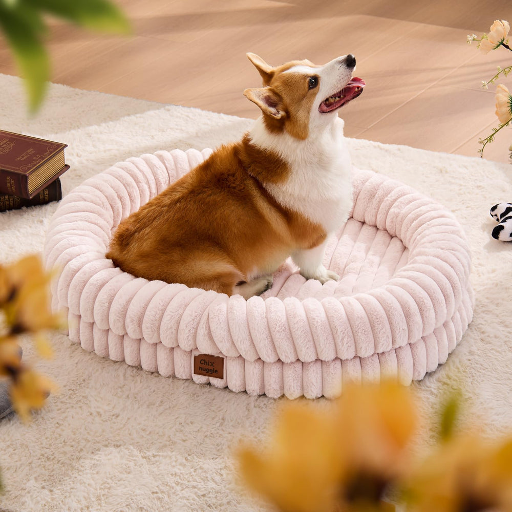 ChiXnuggle dog bed large pink front view showcasing plush fur for comforting lounging