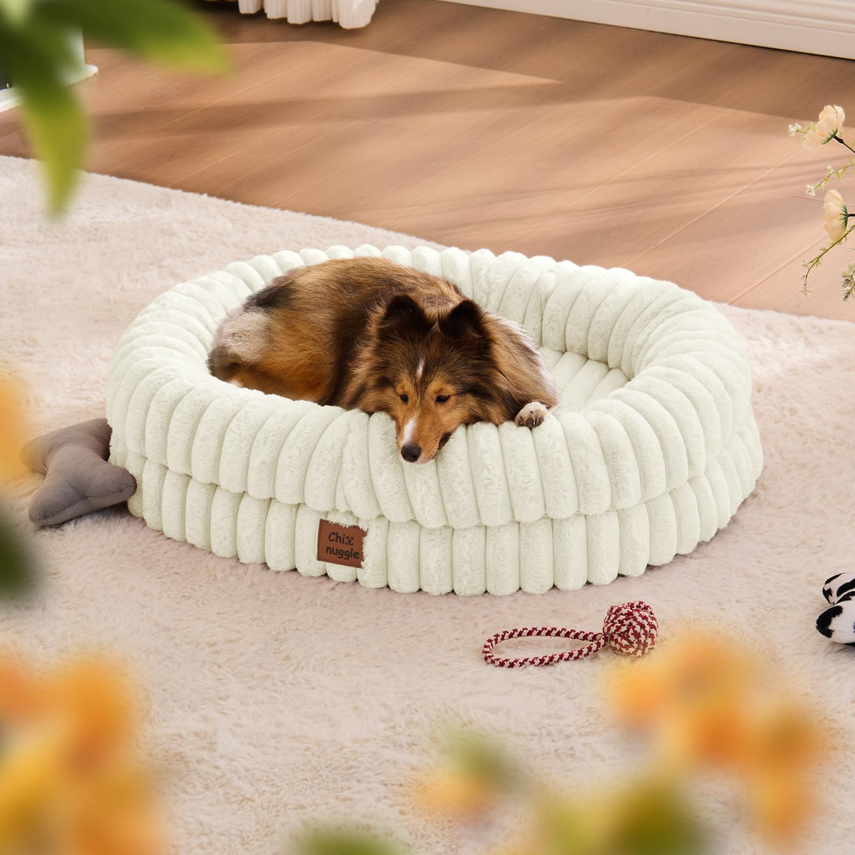 ChiXnuggle dog bed outer view in cream striped fur offering calming plush comfort.