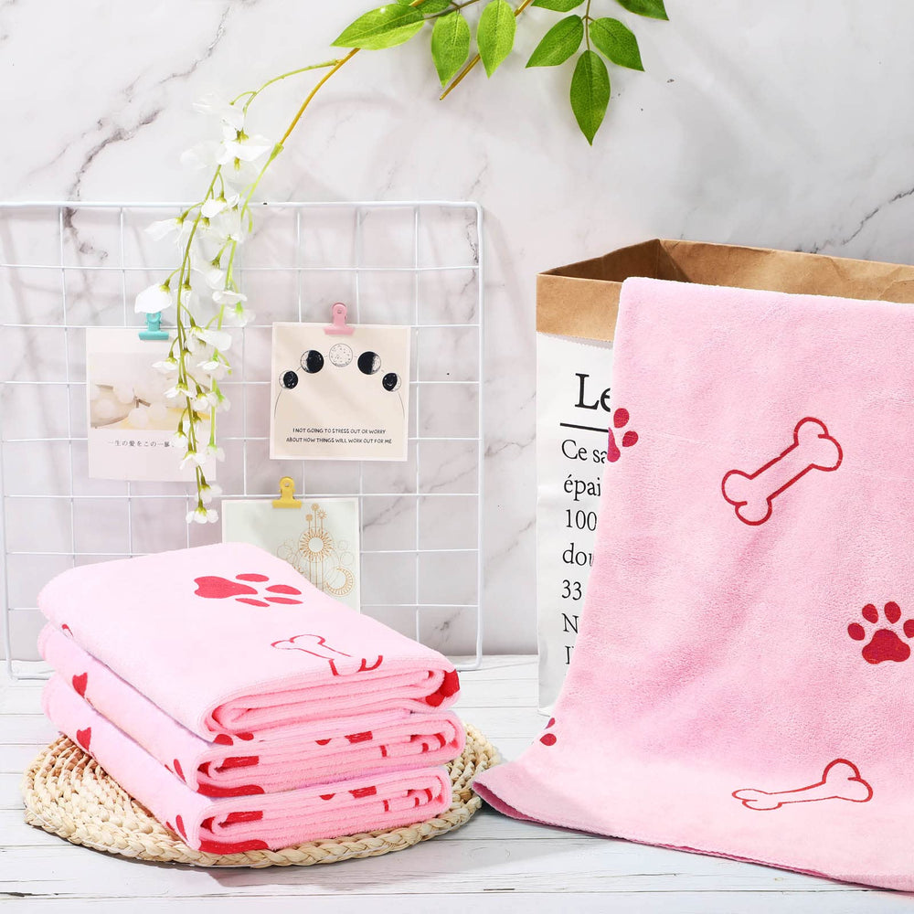 Chumia full-body fit pink towel demonstrates size suitability for small to medium dogs.